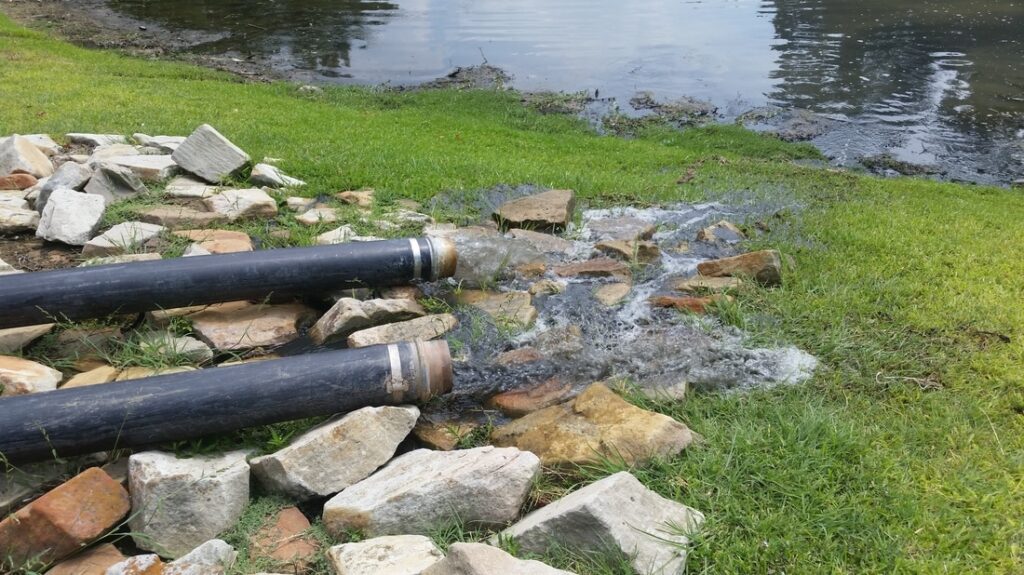 Clean water discharge after dewatering and silt removal services in Texas.