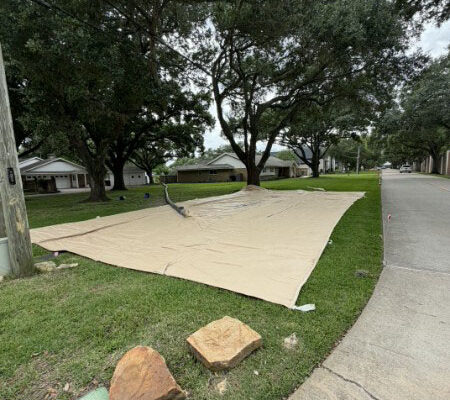 Sugar Land Silt Plug Removal – Geotextile Tube Before Sediment Removal